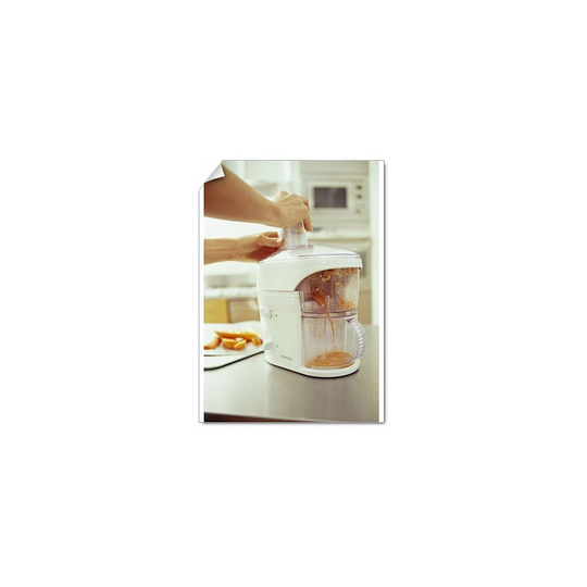 (A2 (59x42cm)) Juicing carrots. The electrical juicer is pulping raw carrots to make a healthy vegetable drink. Carrots are rich (Poster Print)
